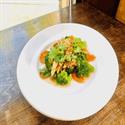 Garlic stir-fry on steamed broccoli and carrot