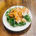 Rama Noodles with peanut sauce over spinach